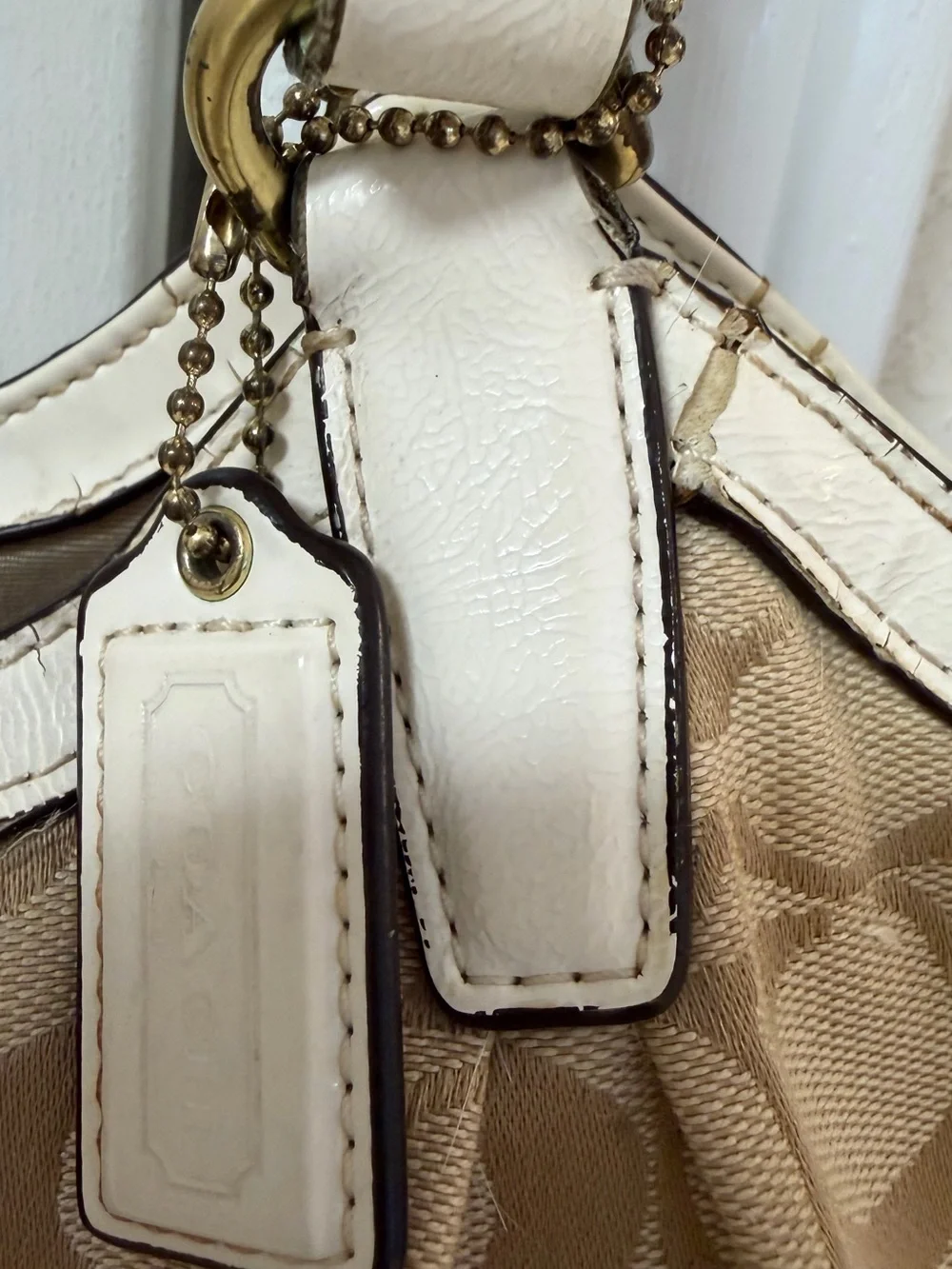 Coach Signature Canvas Beige Tote Bag with Ivory Trim handles are cracked!